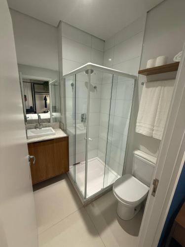 a bathroom with a shower and a toilet and a sink at Hotel In Loft Elleva Studio in Sinop