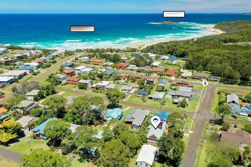 an aerial view of a suburb next to the beach at Neptune's at Manyana in Manyana