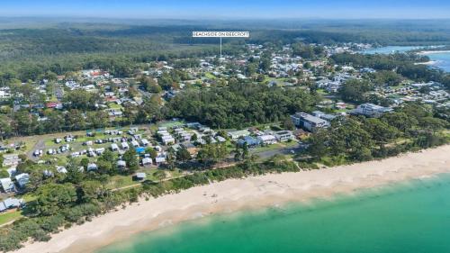 an aerial view of a resort on the beach at Beachside on Beecroft in Huskisson