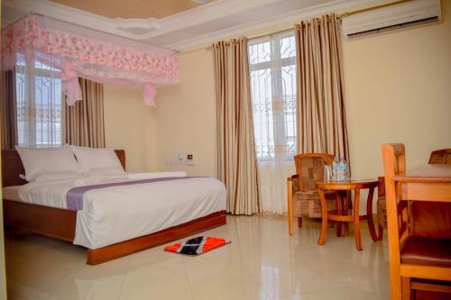 Ένα ή περισσότερα κρεβάτια σε δωμάτιο στο Silver Paradise Hotel