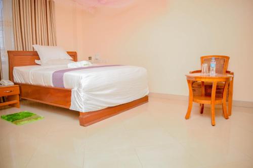 Ένα ή περισσότερα κρεβάτια σε δωμάτιο στο Silver Paradise Hotel