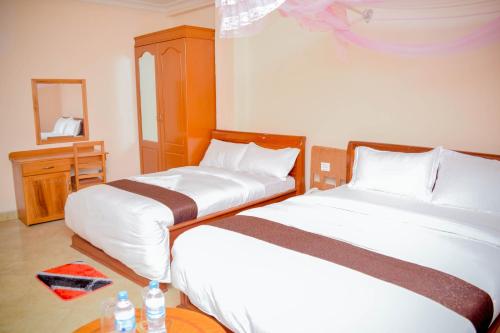 Ένα ή περισσότερα κρεβάτια σε δωμάτιο στο Silver Paradise Hotel