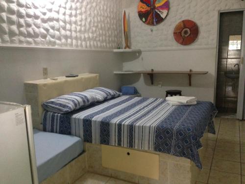 Katil atau katil-katil dalam bilik di Pousada Golfinho