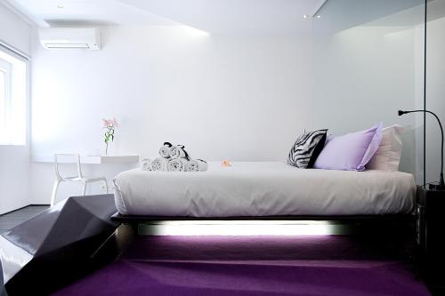 Postel nebo postele na pokoji v ubytování Absoluto Design Hotel