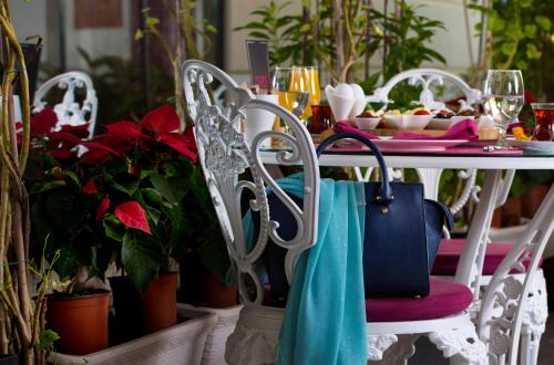 a table with a blue bag sitting on top of it at Nun Hotel in Antalya