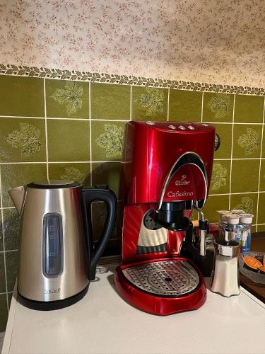 a red coffee maker sitting on top of a counter at Becci Apartment-Free Parking in Kapfenberg