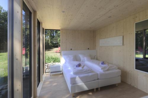 a bedroom in a house with a white bed at mein kleinHOTEL in Herbstein
