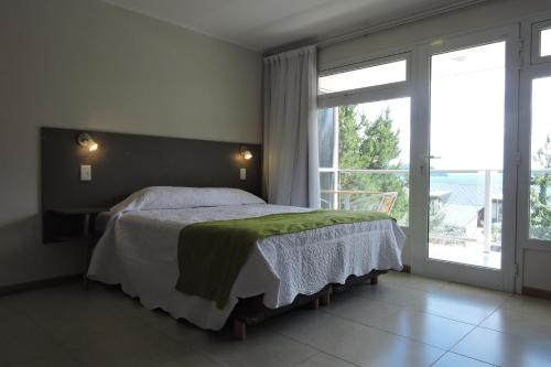 Ένα ή περισσότερα κρεβάτια σε δωμάτιο στο Apart Hotel Bungalows Matute