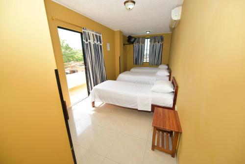 Postel nebo postele na pokoji v ubytování Hotel La Aldea