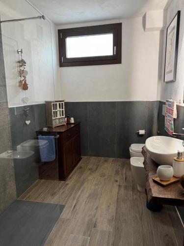 a bathroom with a sink and a toilet and a shower at B&B Borgo dei Cedri in Pontecchio