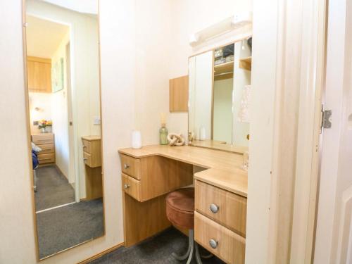 a bathroom with a sink and a mirror at 25 Foxburrow Hang in Great Yarmouth