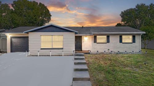 a house with a garage in front of it at 2812 Tulane Dr in Cocoa