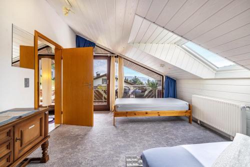 a bedroom with a bed and a window at Studio Wacholderheide in Albstadt