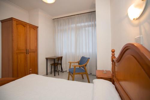 Een bed of bedden in een kamer bij Hotel Venezuela