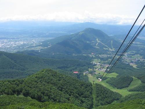 a view of a mountain from a chair lift at Yudanaka Yasuragi in Yamanouchi