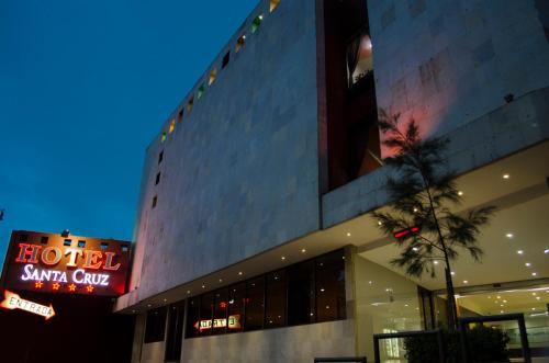 a hotel with a sign on the side of a building at Hotel Santa Cruz in Mexico City