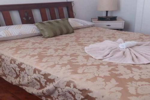 a bed with a dress on top of it at The Ashford Hotel and Restaurant in Ashford