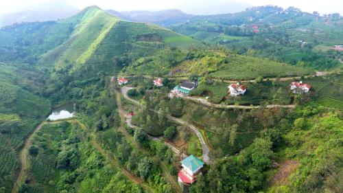 an aerial view of a mountain valley with houses at Falcon Crest in Vagamon