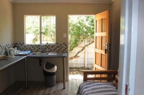 Kuchyň nebo kuchyňský kout v ubytování khaya4u Guesthouse