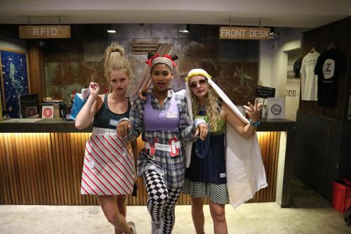 three girls dressed up in costumes in a store at Z Hostel in Manila