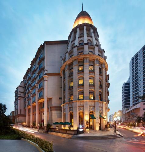a building with a dome on the side of it at The Davis Bangkok in Bangkok