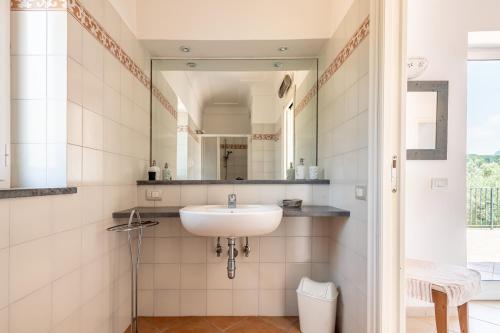 a bathroom with a sink and a mirror at Tra Cielo e Mare & La Dépendance - Fantastic Sea View in Anacapri