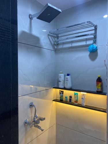 a bathroom with a sink and a faucet at KD Homes in Surat
