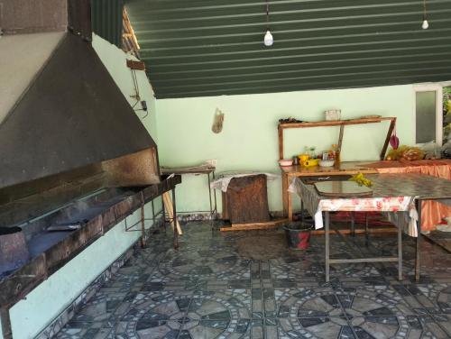 an old room with a table and a mirror at Restaran otel in İsmayıllı
