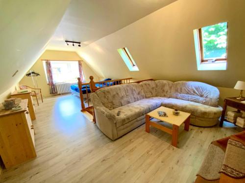 a living room with a couch and a table at Ferienwohnung Scheffler in Krakvitz