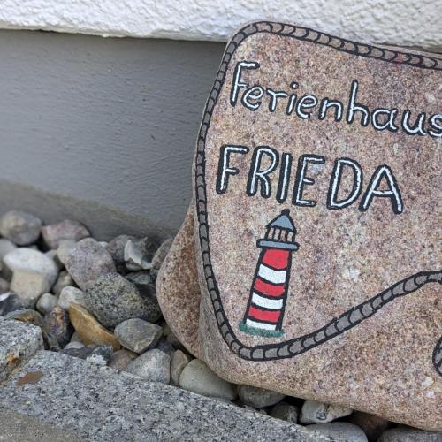 a rock with a picture of a lighthouse on it at Ferienhaus Frieda mit 2 Schlafzimmern in Sagard