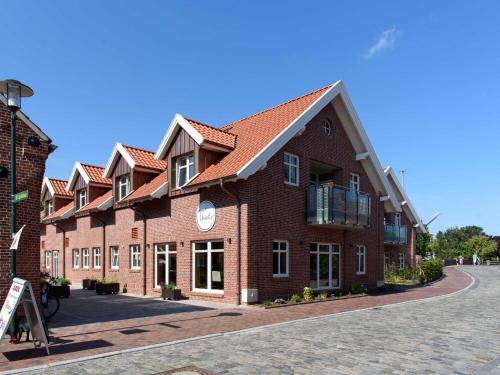 a row of brick buildings on a street at Sielhof Ditzum 45263 in Ditzum
