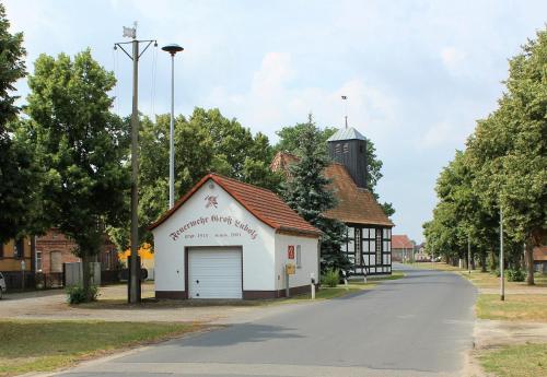 a small white building on the side of a road at Spreewald-Pension Marina in Lübben