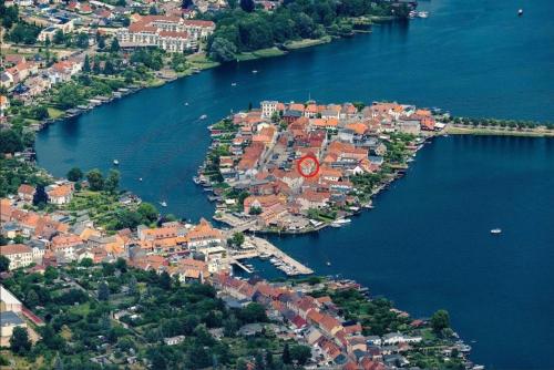 an aerial view of a town on a river at Inseldomizil - Melina in Malchow
