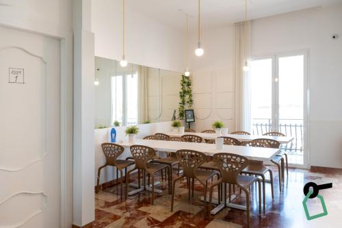a large dining room with a table and chairs at Hotiday Porto Cesareo Spiaggia in Porto Cesareo