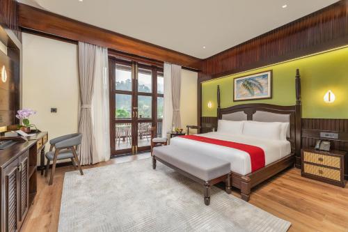 a hotel room with a bed and a television at Latauli Sanctuary in Upardāng Garhi