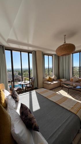 a large bedroom with a large bed and a living room at Villa Mamma Giò in Essaouira