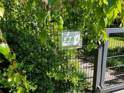 a metal fence with a sign on it at Ferienwohnung Loose in Tecklenburg