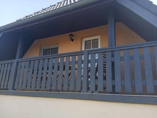 a balcony of a house with a railing at Ferienwohnung Jargow 1 - Alt-Reddevitz in Alt Reddevitz