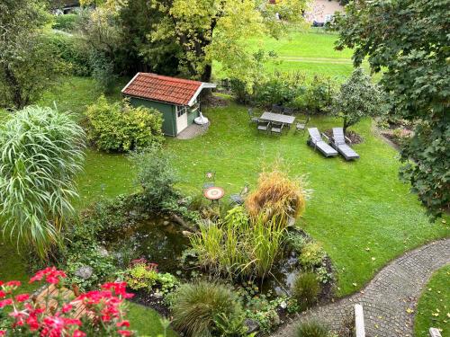 an aerial view of a garden with benches and flowers at Ferienwohnung Kugler in Grafrath