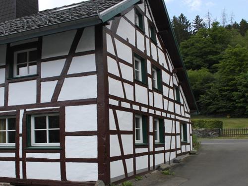an old black and white building with windows at Rurtalgarten in Hammer