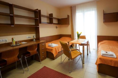 Postel nebo postele na pokoji v ubytování Study K & M Hotel