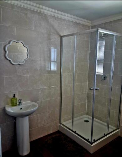 a bathroom with a shower and a sink at Herdman's Rest Farmstay in Lady Grey