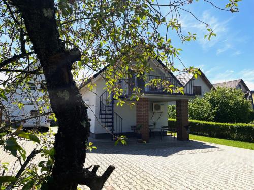 a house with a black and white roof at Gästehaus Seenland in Lauta
