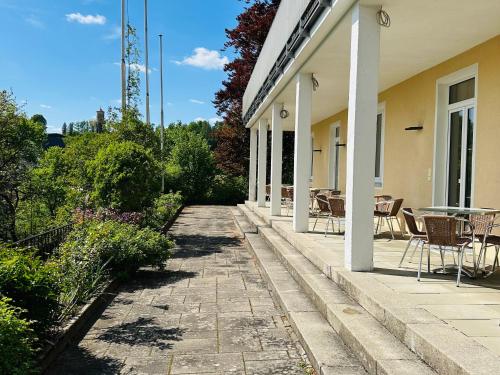 a patio with chairs and a table on a house at GER-Haus in Waischenfeld