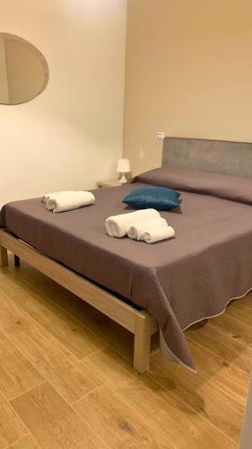 a large bed with two pillows on top of it at Masseria della Fontana Vecchia in San Cipriano Picentino