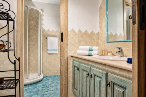 a bathroom with a sink and a shower at Big Pevero Sea View House 8 Three Bedrooms in Porto Cervo