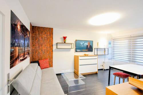 a living room with a couch and a table at Matzlow, Fewo Voss in Garwitz