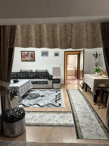 a living room with a couch and a table at Suc Valley in Klos