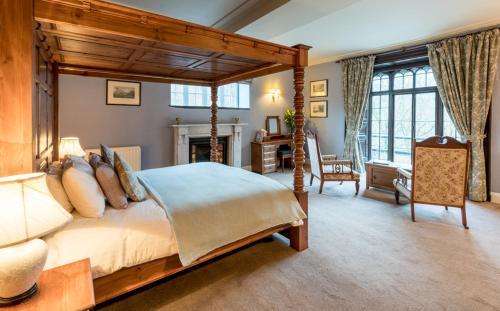 a bedroom with a bed and a dresser at Glen Rothay in Ambleside