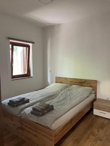 a bedroom with a bed with two suitcases on it at Apartment Sole in Poreč